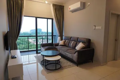 a living room with a couch and a table at The Horizon Ipoh Infinity Pool 5 to 9pax in Ipoh