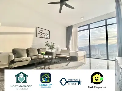 a living room with a couch and a ceiling fan at Beacon Executive Suites #Minimalist #SkyPool #Georgetown #6pax #2BR 2bath #3 Queen #Quality well maintained #Private host in George Town