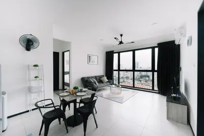 a white living room with a table and chairs at NEW Infinity Pool 3 Bedrooms 2 Carparks 197 in Jelutong