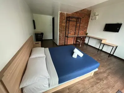 a room with a bed with a blue mattress at Big Dreams Garden Stay in Tanah Rata