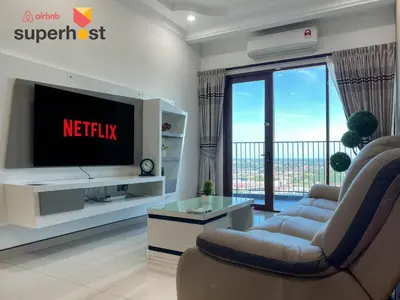 a living room with a tv and a couch at Taiping City View 3BR Condo near Lake Garden with Sunset View & Swimming Pool, Free Netflix WiFi in Taiping