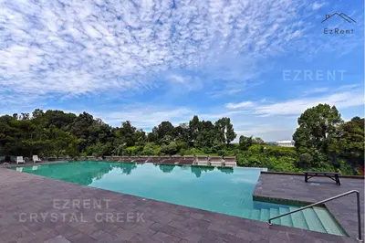 a swimming pool with chairs and a cloudy sky at Taiping City View 3BR Condo near Lake Garden with Sunset View & Swimming Pool, Free Netflix WiFi in Taiping