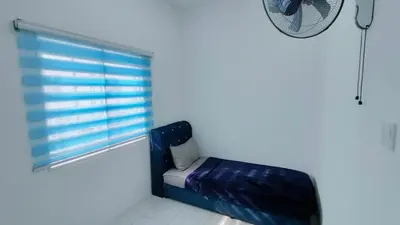 a room with a blue window and a mattress at FIRASH HOMESTAY AT SERI ISKANDAR in Seri Iskandar
