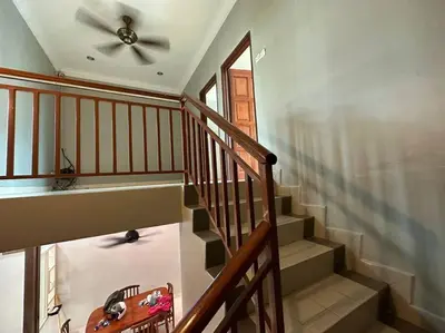 a staircase with a ceiling fan in a house at Muslim Suite Home @ Airport Bayan Lepas Penang in Bayan Lepas