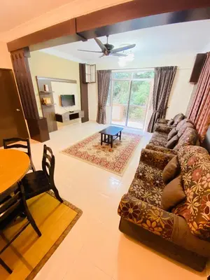 a living room with a couch and a table at Qaseh Homestay Cameron Highlands 3 in Brinchang
