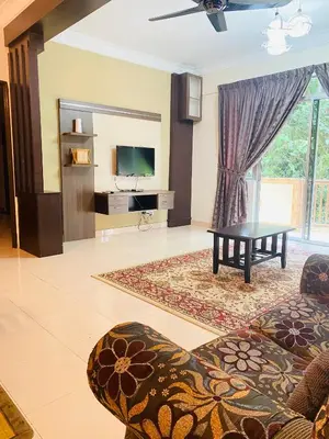 a living room with a couch and a table at Qaseh Homestay Cameron Highlands 3 in Brinchang