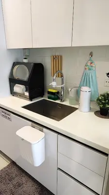 a kitchen counter with a sink and a microwave at SkyPool 2BR 9pax Premium Suite@Beacon @Georgetown @Penang in George Town