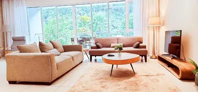 a living room with a couch and a table at IPOH All Suite Resort, Jalan Haven, Persiaran Lembah Perpaduan, Ipoh in Ipoh