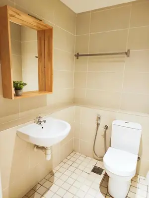 a bathroom with a toilet and a sink at IPOH All Suite Resort, Jalan Haven, Persiaran Lembah Perpaduan, Ipoh in Ipoh
