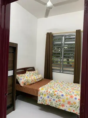 a bedroom with a bed and a window at Rezeki indah Hstay self check in in Bukit Mertajam