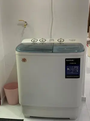 a stove sitting in a kitchen next to at Rezeki indah Hstay self check in in Bukit Mertajam