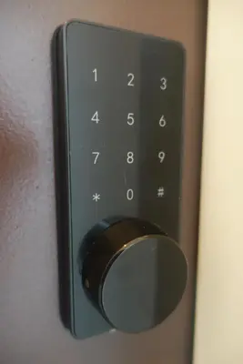 a close up of a remote control on a wall at Monstera Meritus Homestay - Penang Butterworth Prai 1-8PAX in Perai