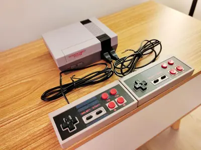 a video game system sitting on a table at Monstera Meritus Homestay - Penang Butterworth Prai 1-8PAX in Perai