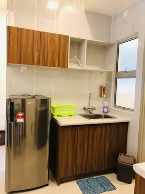 a kitchen with a stainless steel refrigerator and a sink at Cameron Highlands, The Breeze @ Barrington Square in Brinchang