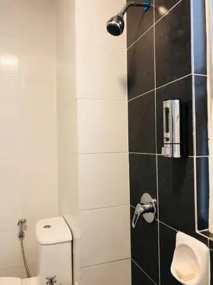 a bathroom with a shower with a toilet and a sink at Cameron Highlands, The Breeze @ Barrington Square in Brinchang