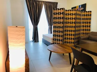 a living room with a couch and a table at Cameron Highlands, The Breeze @ Barrington Square in Brinchang