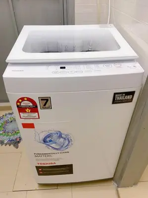 a white appliance sitting on top of a box at Homestay 2 @Taman Teluk Intan in Teluk Intan