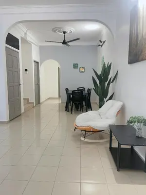 a living room with a couch and a table at Homestay 2 @Taman Teluk Intan in Teluk Intan