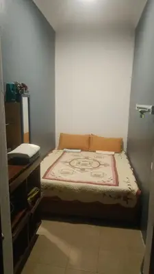 a small bedroom with a bed in a room at Mini Studio in Permatang Pauh