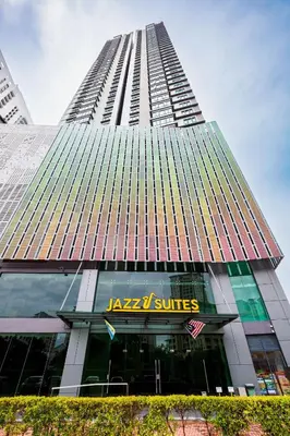 a tall building with a japan suites sign on it at The Jazz Serviced Suites in Tanjong Tokong
