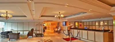 a large room with a lobby with a bar at Royale Chulan Penang in George Town