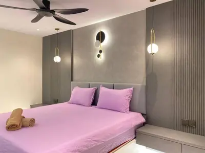 a bedroom with a pink bed with a teddy bear on it at Brand New Premium House & Karaoke @BM Near Iconcity in Bukit Mertajam