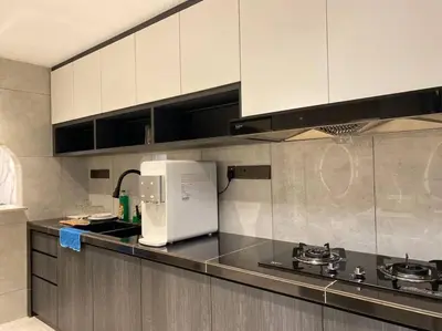 a kitchen with a stove and a white refrigerator at Brand New Premium House & Karaoke @BM Near Iconcity in Bukit Mertajam