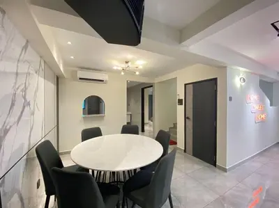 a dining room with a white table and chairs at Brand New Premium House & Karaoke @BM Near Iconcity in Bukit Mertajam