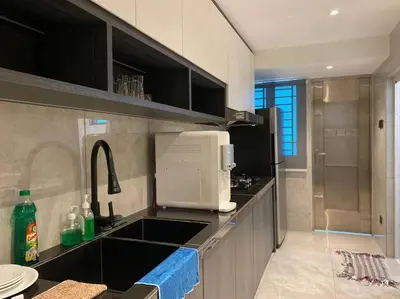 a kitchen with a sink and a microwave at Brand New Premium House & Karaoke @BM Near Iconcity in Bukit Mertajam