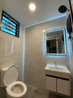 a bathroom with a white toilet and a sink at Brand New Premium House & Karaoke @BM Near Iconcity in Bukit Mertajam