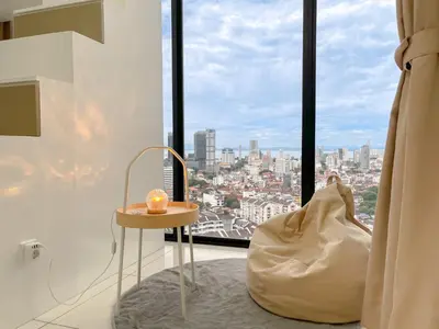 a room with a view of a city from a window at Beacon Executive Suite with SkyPool 3BR 8pax Georgetown Penang in Georgetown