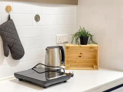 a blender sitting on top of a kitchen counter at Beacon Executive Suite with SkyPool 3BR 8pax Georgetown Penang in Georgetown