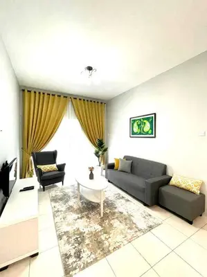 a living room with a couch and a table at Hanna Homestay Apartment for Muslim in Tanah Rata
