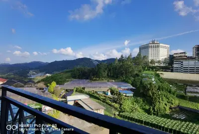 a view of a city from a balcony at Cameron Square, Nova Highlands - 1BR Studio Suite in Brinchang