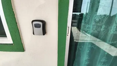 a window with a dog tracker on the side of a building at Homestay LK in Sitiawan