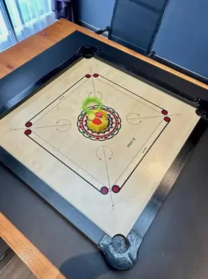 a table with a game on top of it at Ipoh 19A Villa for 12pax 6 Carpark with BBQ by IWH in Ipoh