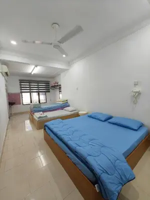 a bedroom with two beds in a room at Pangkor Island Seaside @ 4 rooms Homestay in Pasir Bogak