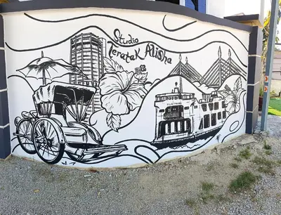 a mural on the side of a building with a street bike at Studio Teratak Alisha Permatang Pauh in Permatang Pauh
