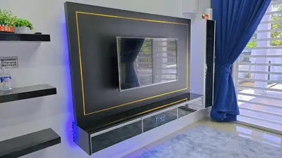 a tv with a mirror on a wall at Homestay By MSH Seri Iskandar in Seri Iskandar