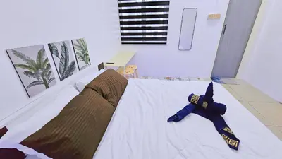 a bedroom with a bed with a blue dinosaur on it at Homestay By MSH Seri Iskandar in Seri Iskandar
