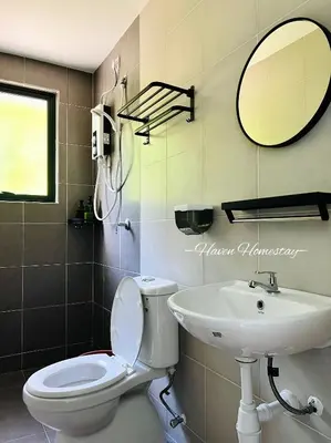 a bathroom with a toilet and a sink at Haven Homestay\u6676\u6676\u5c4b (Brand New Homestay!) in Kampong Sungai Udang