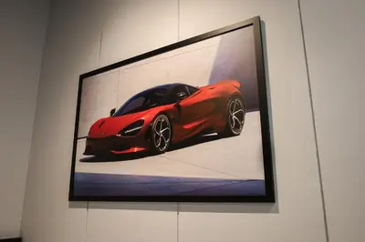 a picture of a red sports car on a wall at FAST FIVE At Gurney in Tanjong Tokong