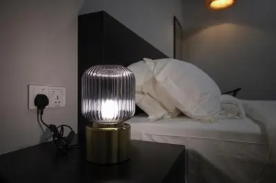 a lamp sitting on a table next to a bed at FAST FIVE At Gurney in Tanjong Tokong