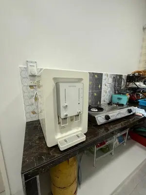 a sewing machine sitting on top of a table at Mikhail's Homestay in Sungai Petani