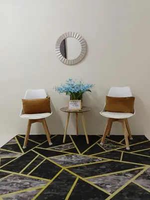 two chairs and a mirror in a room with a rug at Homestay Kak Ninie in Teluk Intan