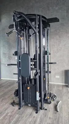 a gym with a treadmill and a chair in a room at H&W Sunway Onsen Suite Tambun Sunway City Ipoh in Ipoh