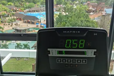 an alarm clock sitting in front of a window at H&W Sunway Onsen Suite Tambun Sunway City Ipoh in Ipoh