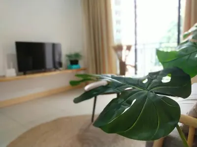 a green plant in a living room with a television at be.Bamboo The Cove-6mins Lost World Tambun-10pax in Ipoh