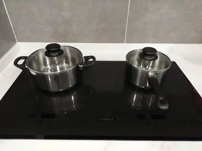 two metal pots sitting on top of a stove at be.Bliss-8mins Lost World Tambun-6-7pax in Ipoh