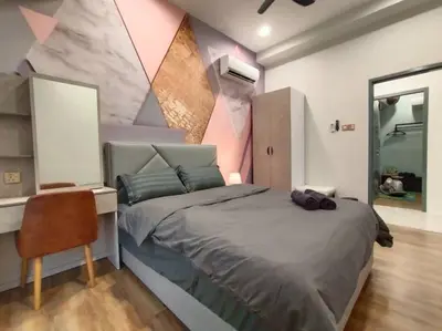 a bedroom with a bed and a desk with a chair at be.Bliss-8mins Lost World Tambun-6-7pax in Ipoh